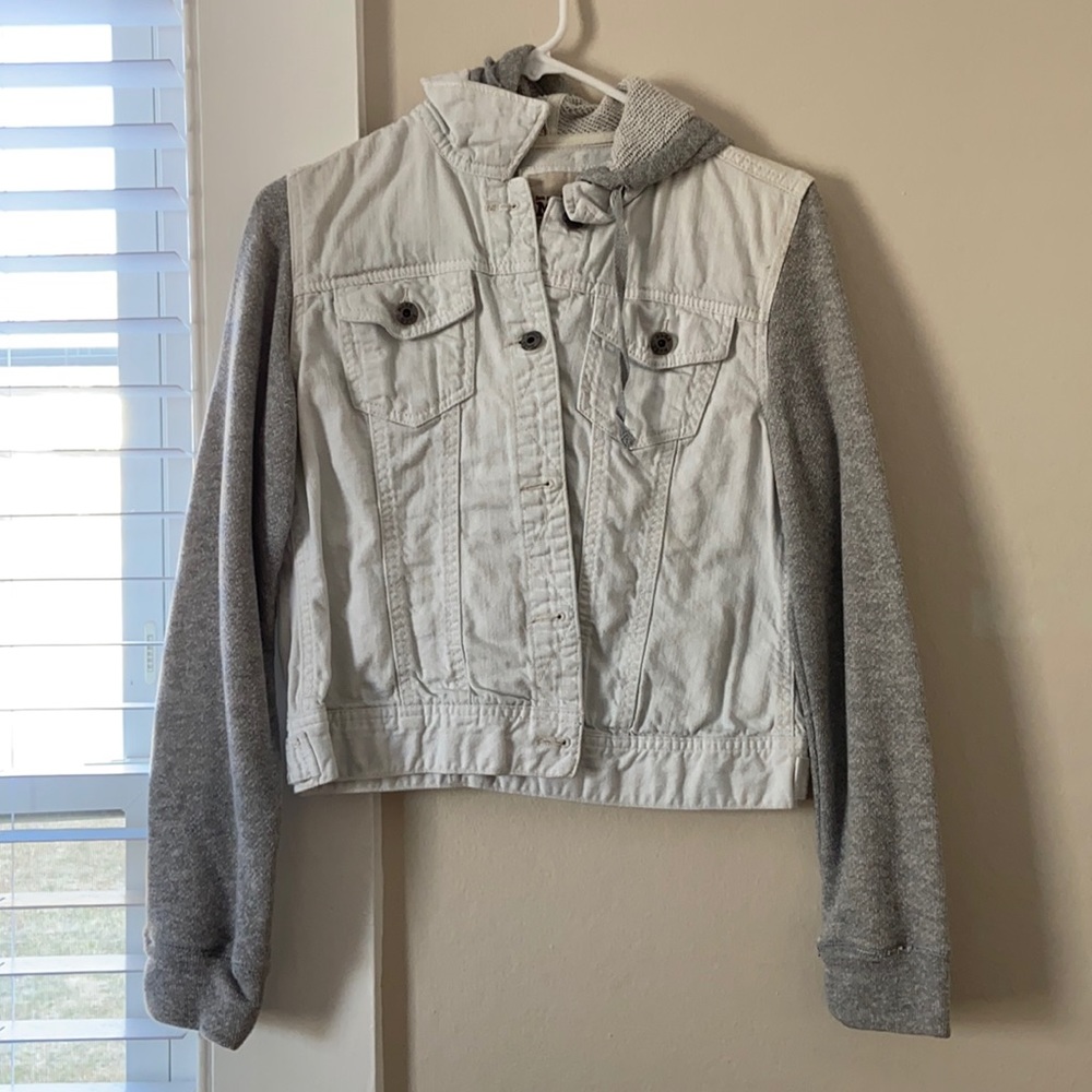 White jean jacket with sweater sleeves